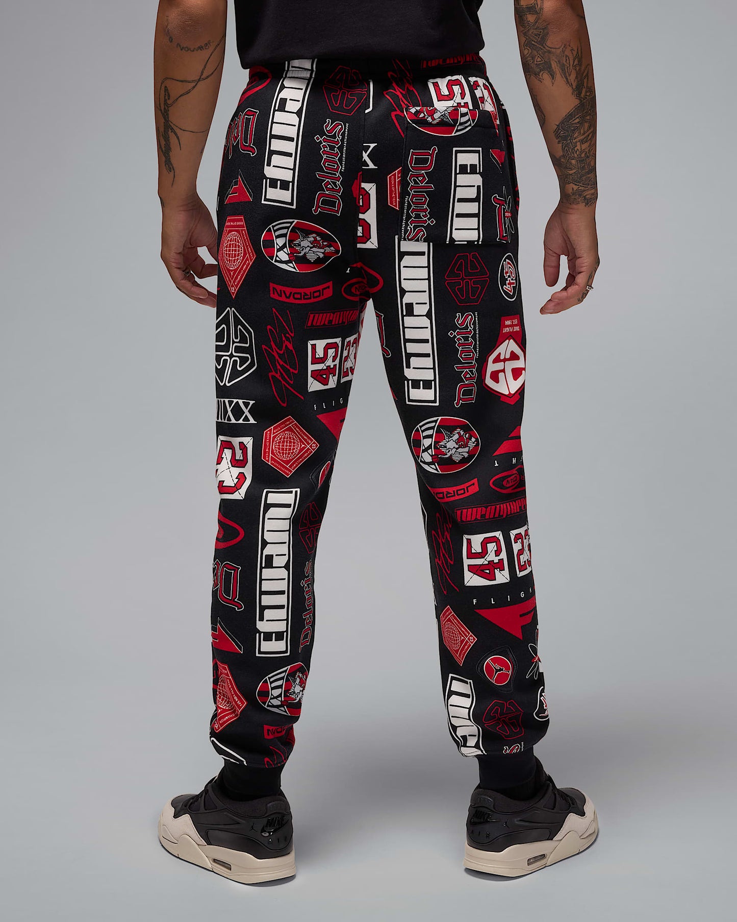Nike Men's Jordan Essentials Printed Fleece Pants Apparel - Black / Varsity Red